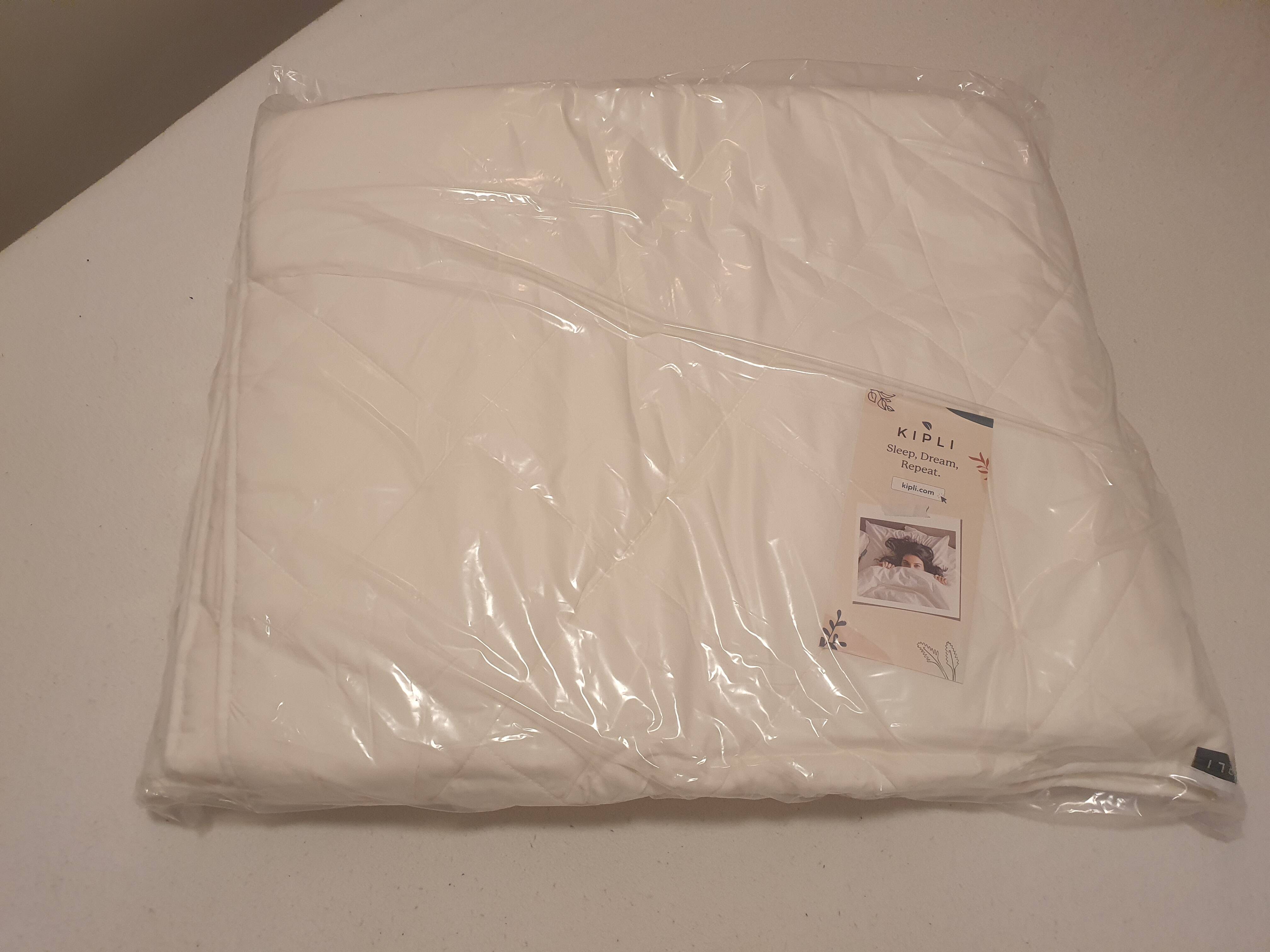 Kipli dekbed in plastic